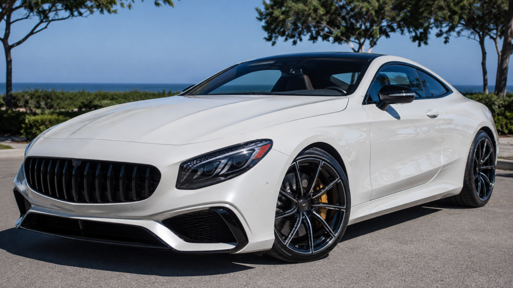 White luxury coupe with high-gloss ceramic coating protection under bright California sunlight.