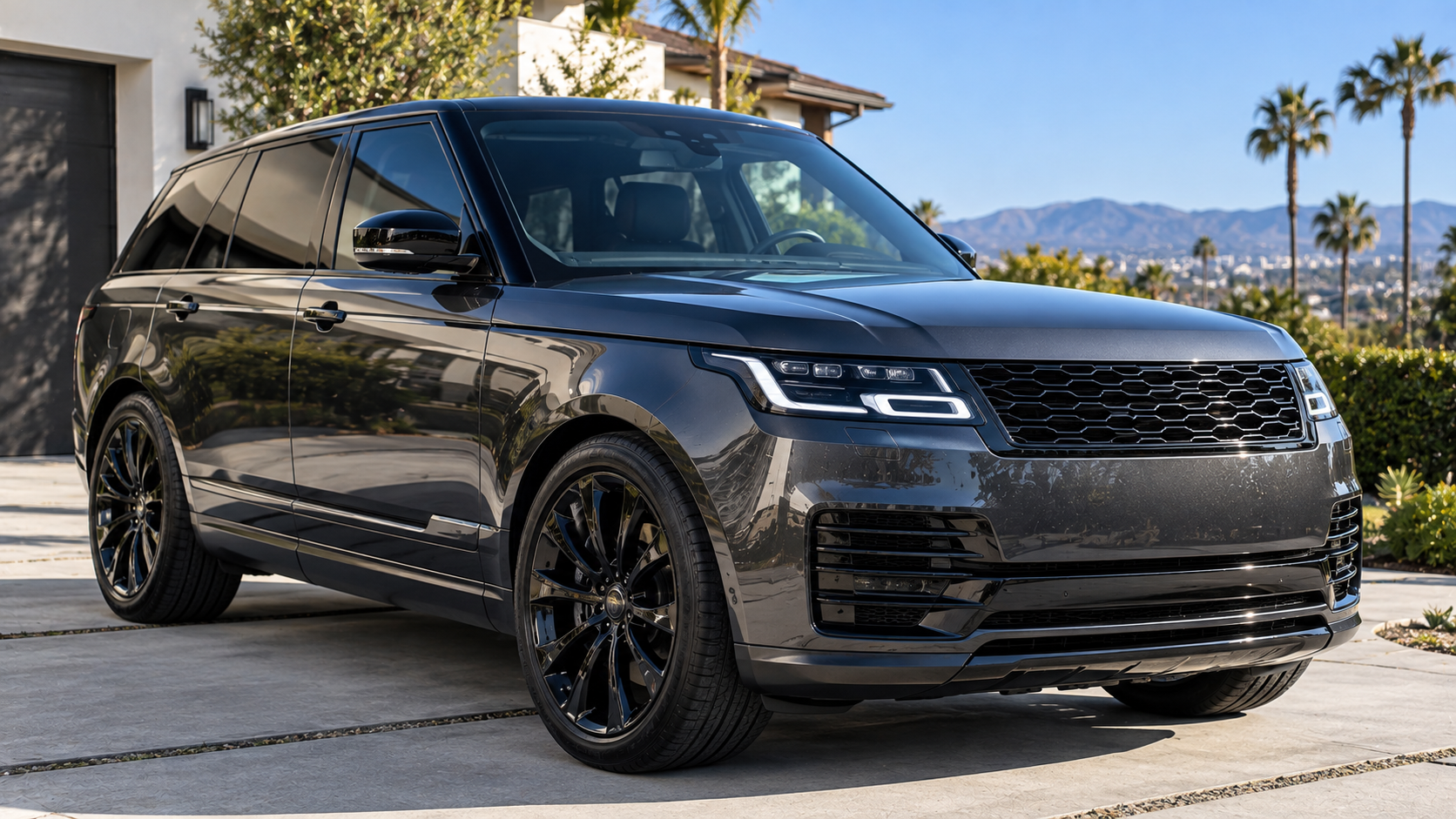 harcoal metallic SUV with high-gloss clear coat paint protection parked in a California residential setting.